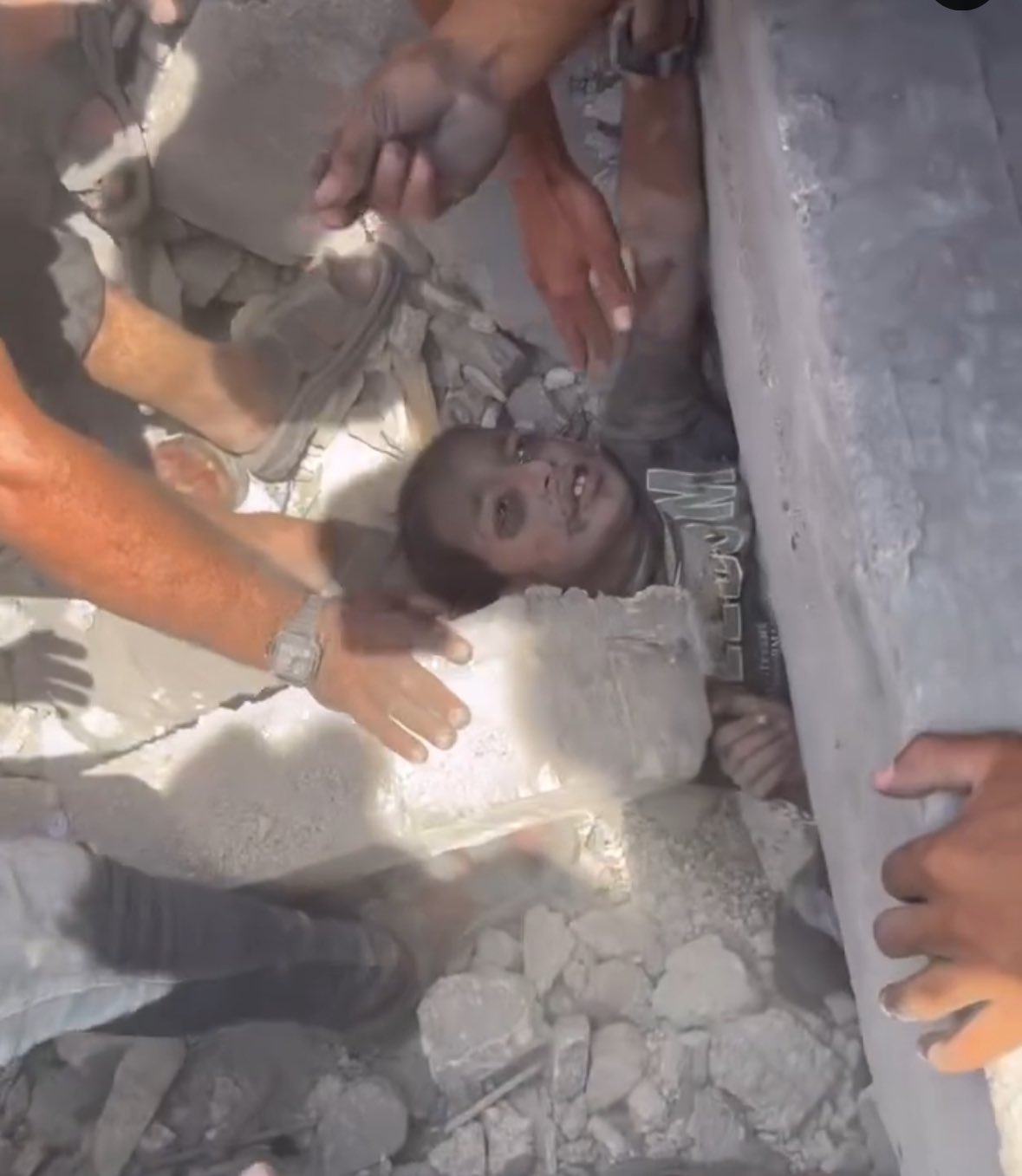 Six-year-old boy rescued from rubble smiles safely