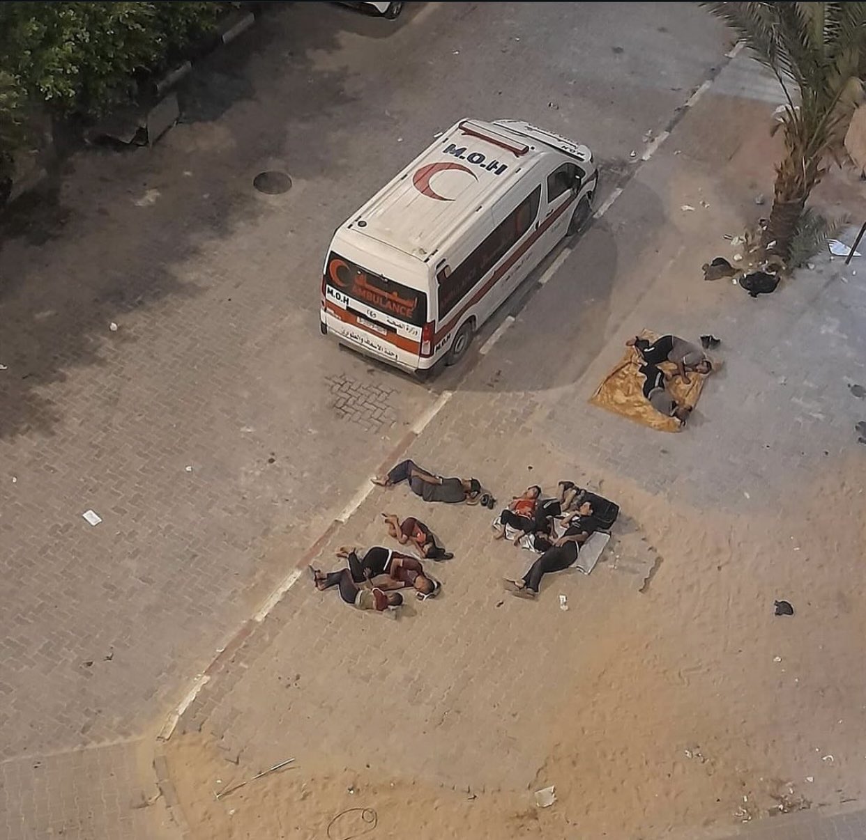 Displaced Palestinians Sleep in Al Aqsa Hospital Courtyard