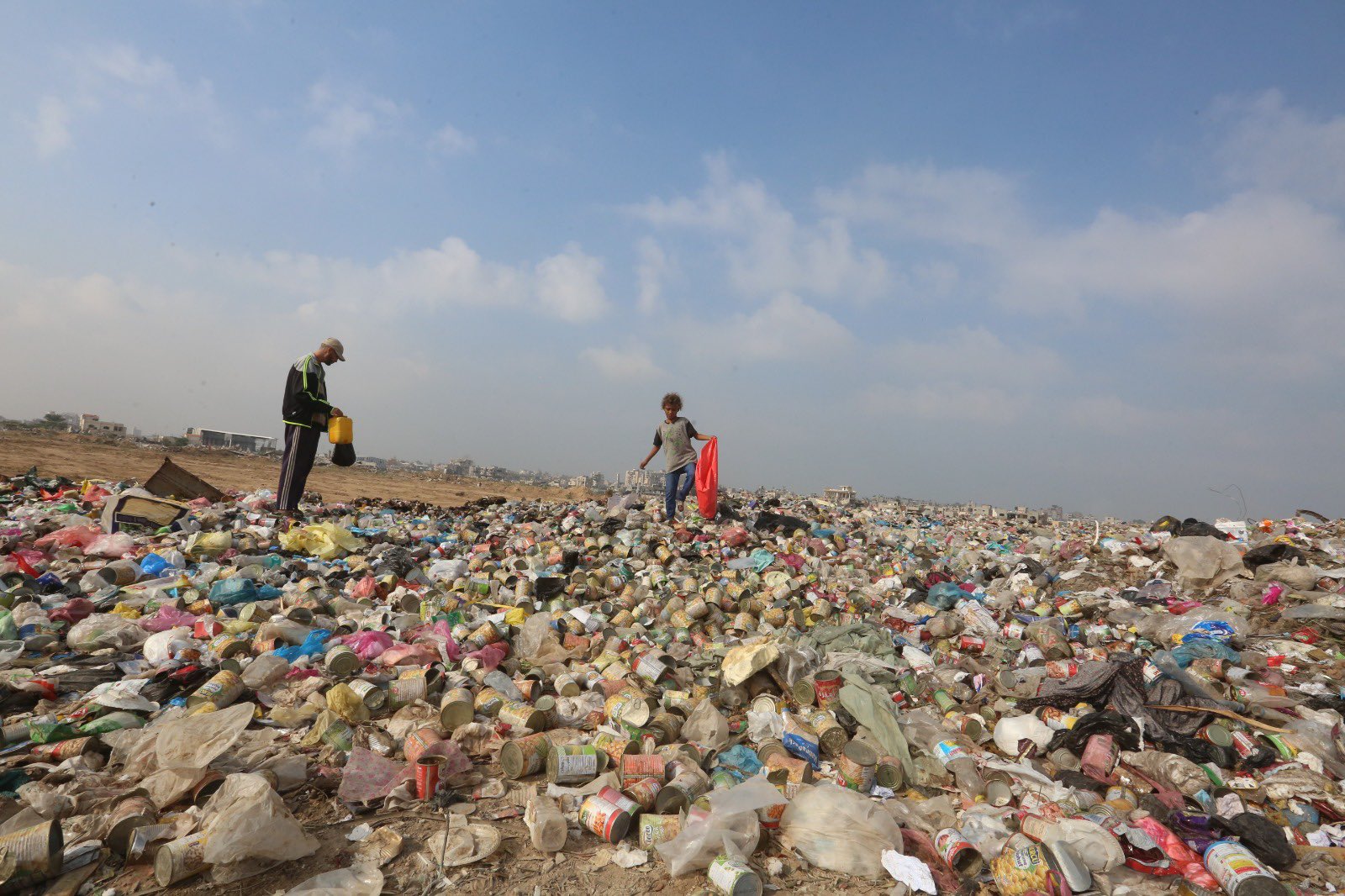 Displaced Persons Seek Firewood and Plastic for Cooking and Heating