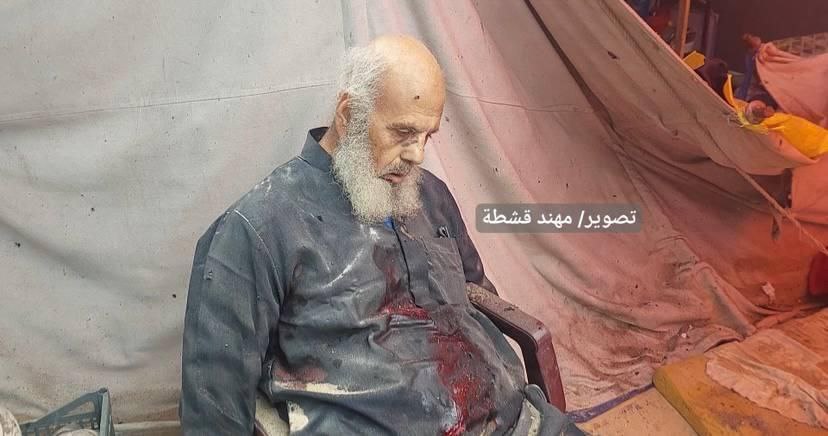 Elderly man martyred while sitting peacefully in front of tent