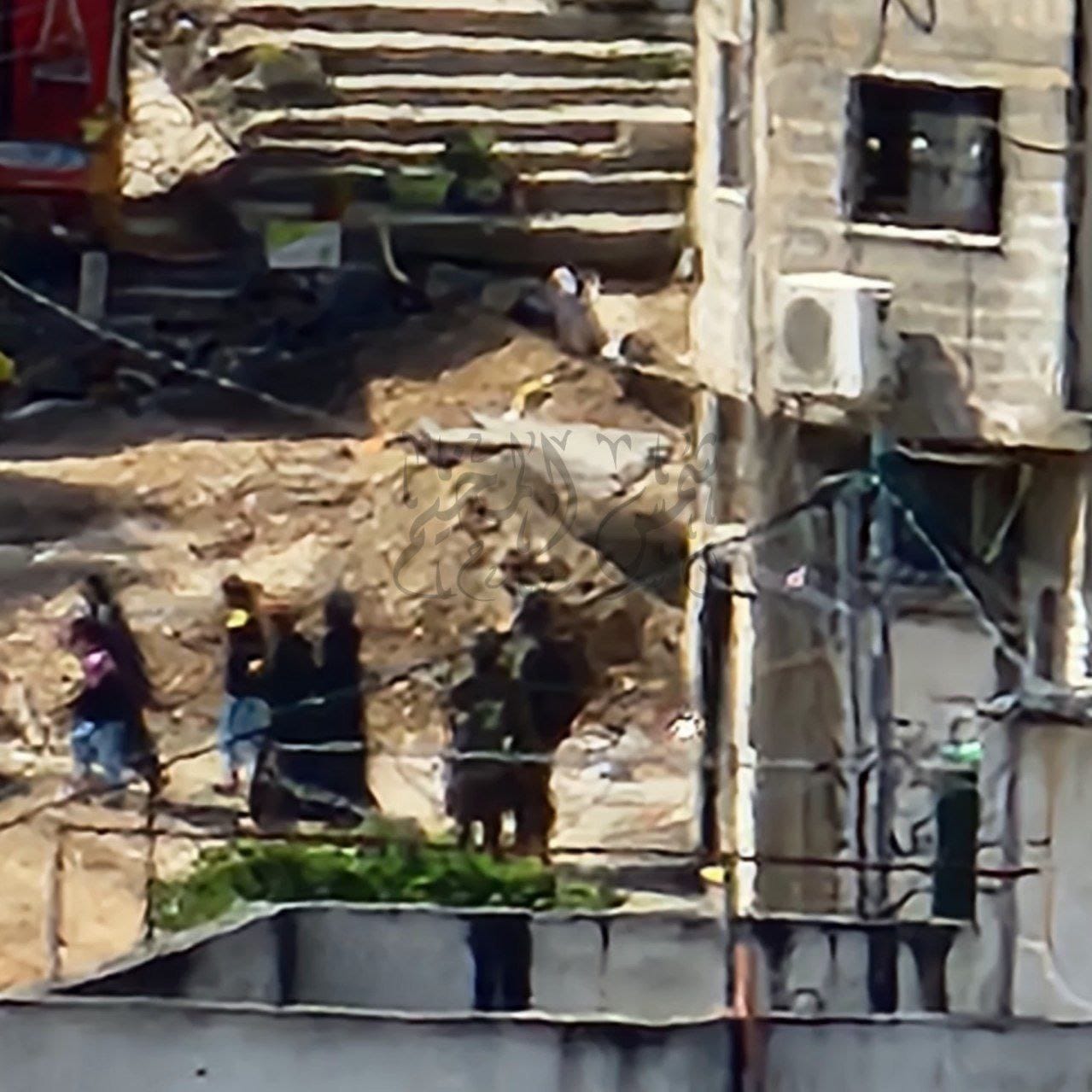 Israeli soldiers remove civilians from Nour Shams camp
