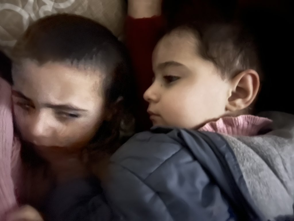 Children after nearby Israeli bombing