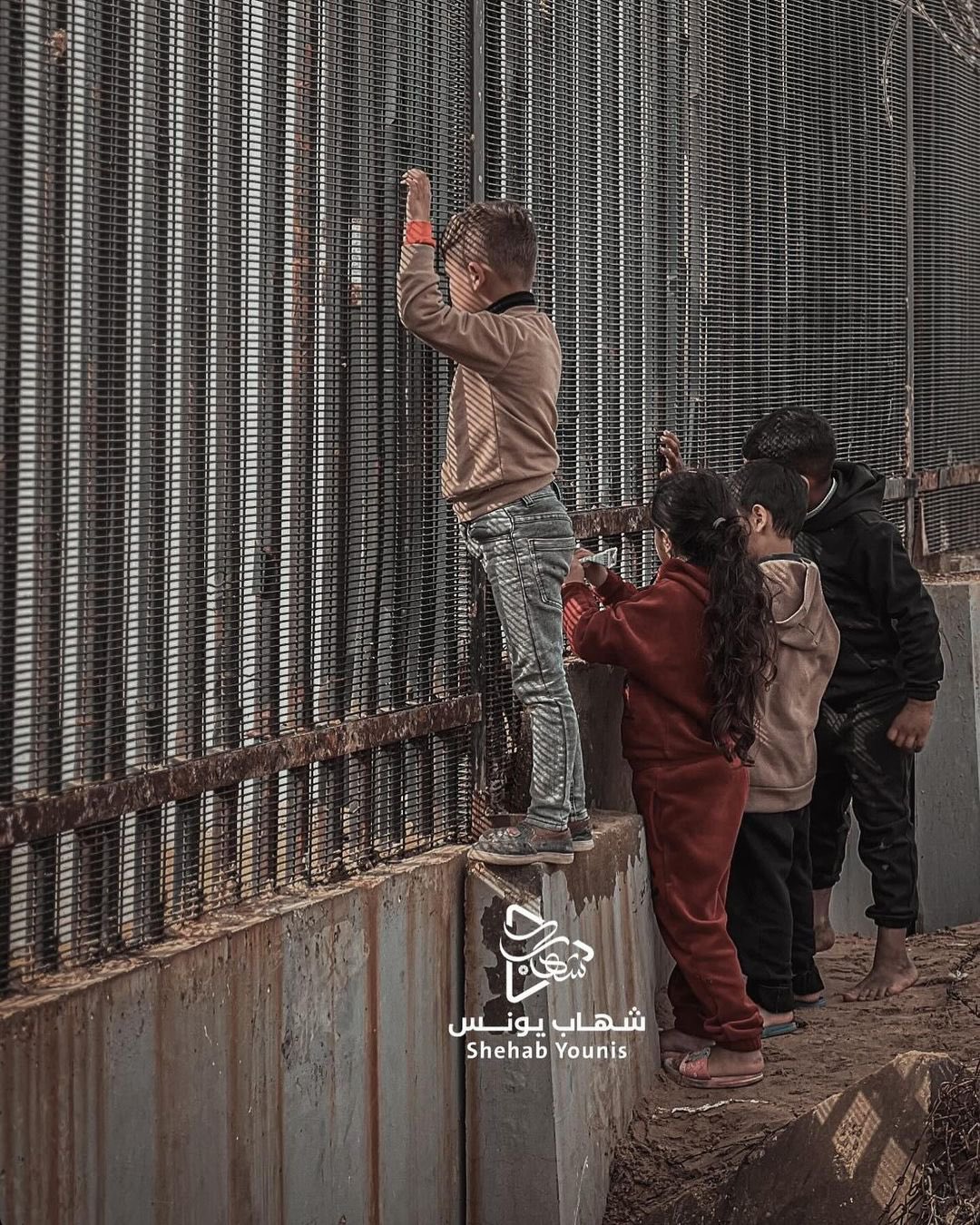 Displaced Palestinian Children at Gaza-Egypt Border Fence