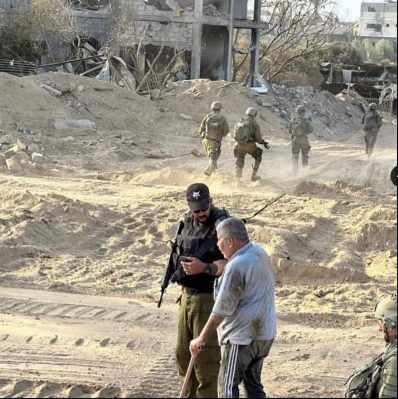 Israeli soldiers accused of killing elderly Palestinian man after staged photo