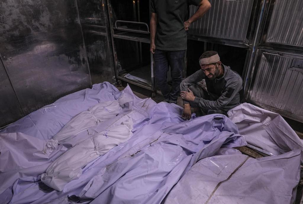 Morgue refrigerators at Al-Shifa Hospital show Beach Camp casualties
