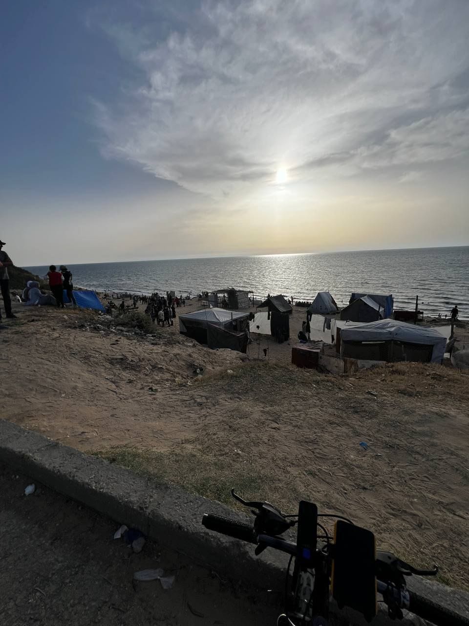 Palestinians seek relief at Nuseirat beach amid power outage