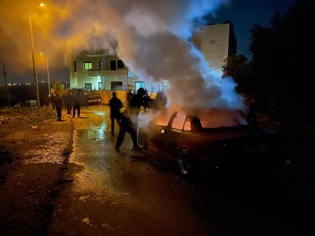 Israeli settlers attack Kafr Nema village, burn vehicles