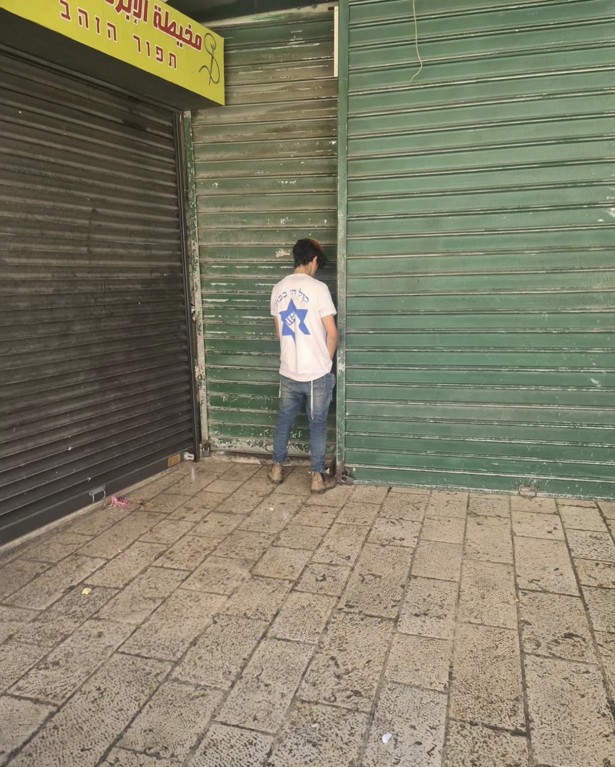 Israeli urinates at Palestinian shop in Jerusalem after settler attack