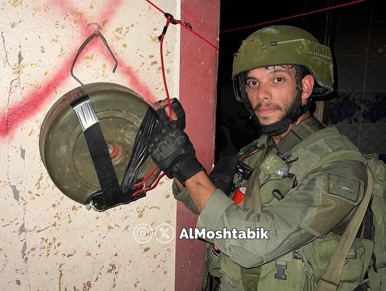 IOF soldier shares photos planting explosives, posing with children’s toys