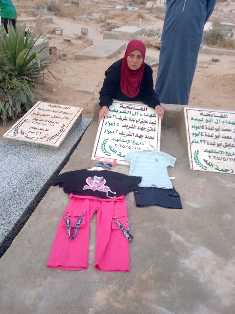 Grandmother places Eid clothes on grandchildren’s graves