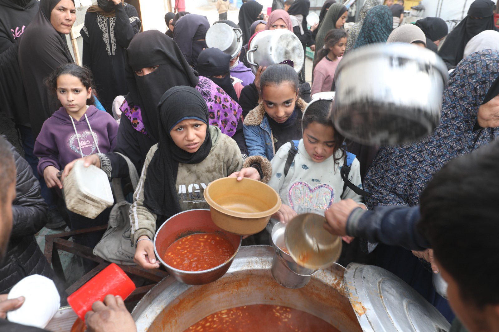 Gazans Receive Iftar Food at Al Nuseirat Refugee Camp Soup Kitchen