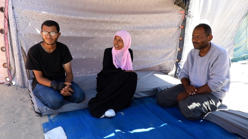 Palestinian woman recounts male relatives detained, stripped, and beaten