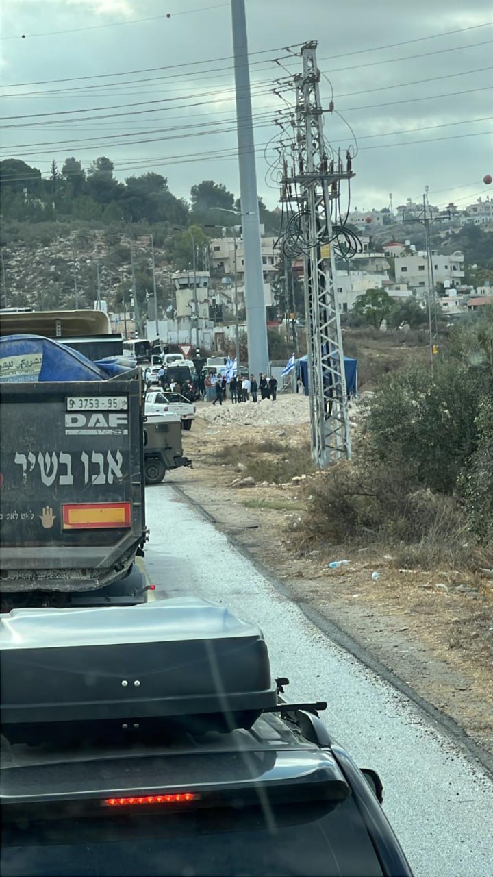 Israeli settlers erect tent at entrance to closed Idhna, west of Hebron