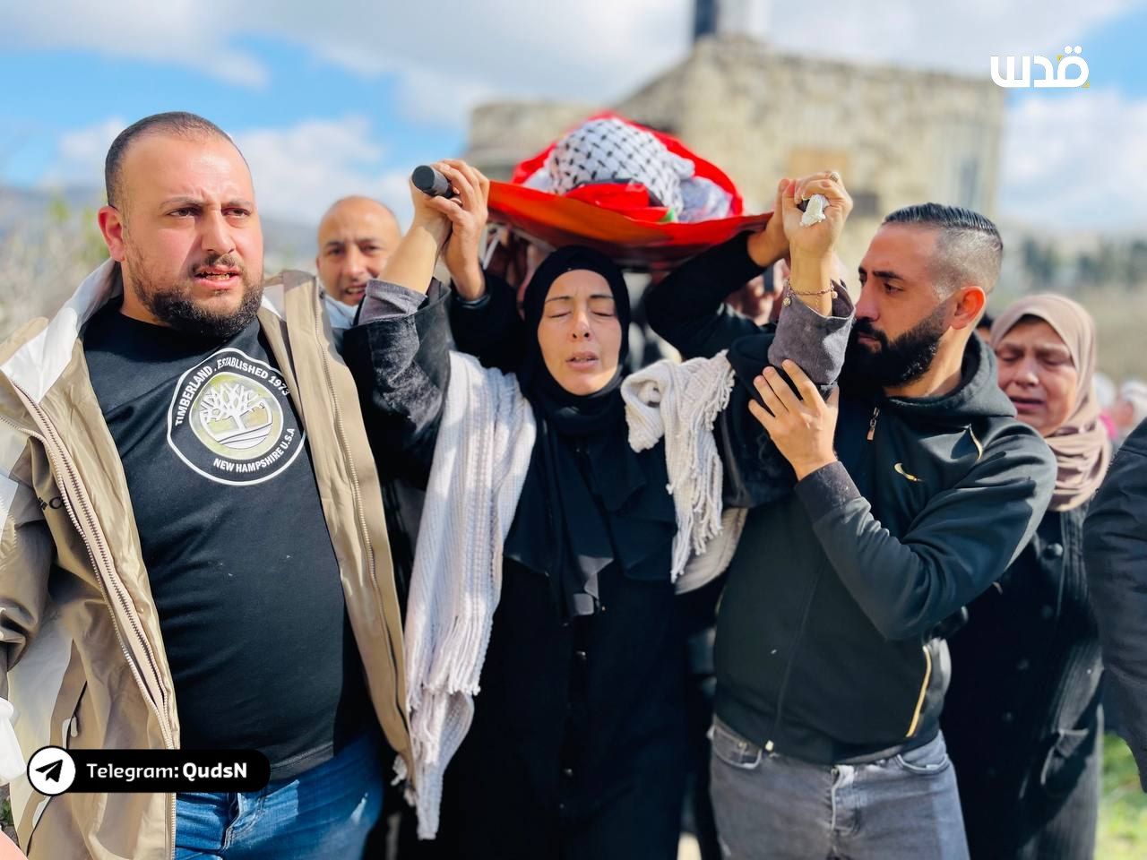 Grieving mother carries body of Ahmad Rashid Jazar in Sebastia funeral