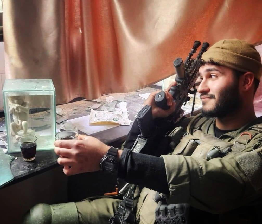 Israeli soldier poses with preserved fetus in Gaza