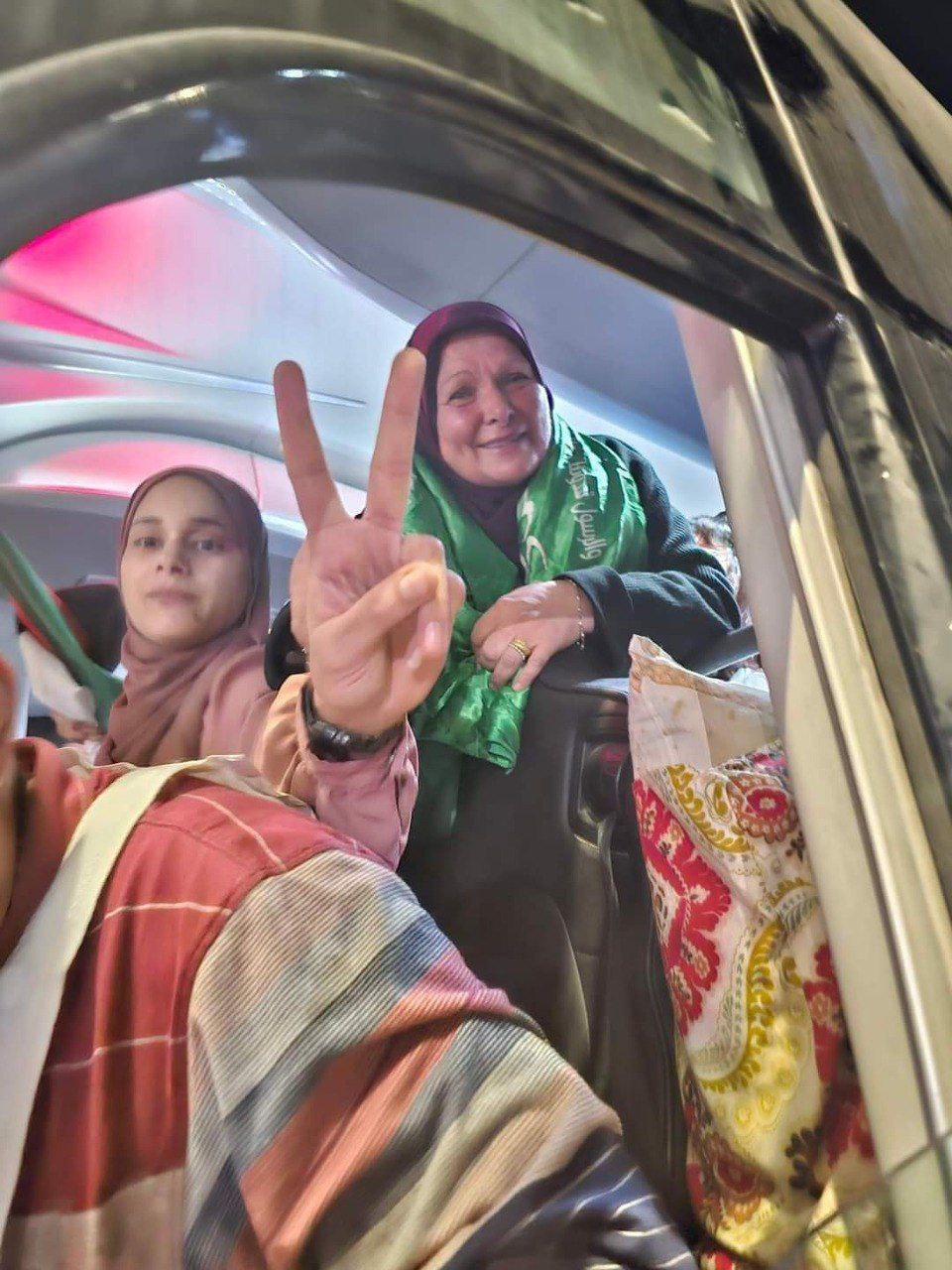Released Palestinian female prisoners raise V sign in Beitunia, West Bank