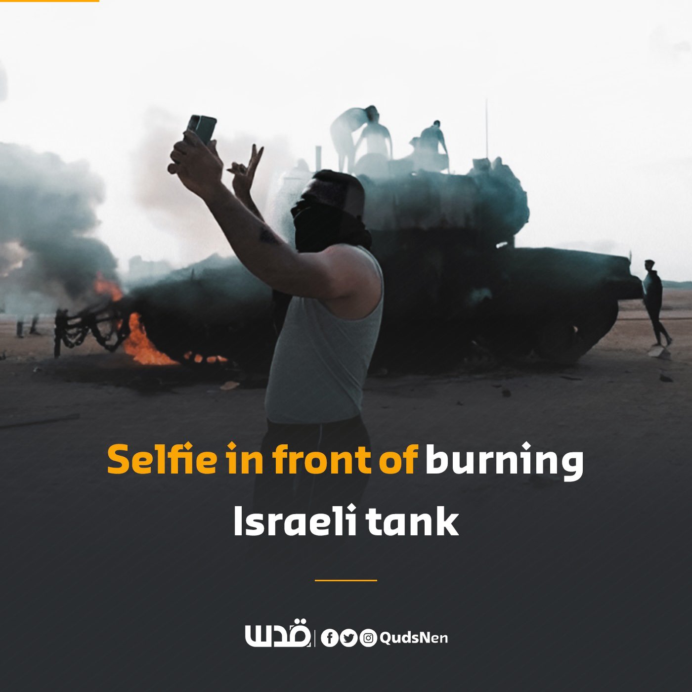 Palestinian man selfies in front of burning Israeli tank near Gaza fence