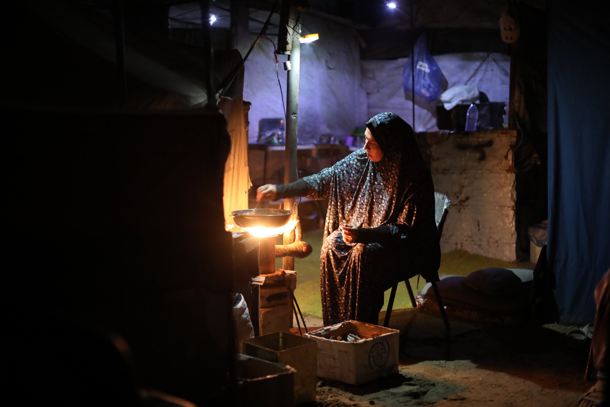 Woman lights fire at Nuseirat displacement camp amid gas shortage