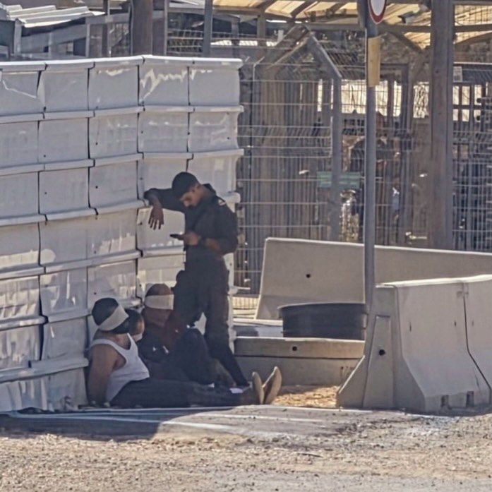 Blindfolded Palestinian detainees held outside Salem Military Court