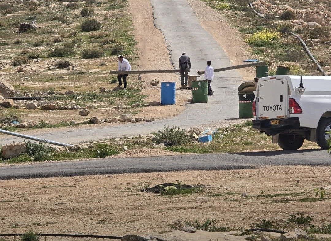 Israeli settlers block road to Umm Al-Khair village in Masafer Yatta