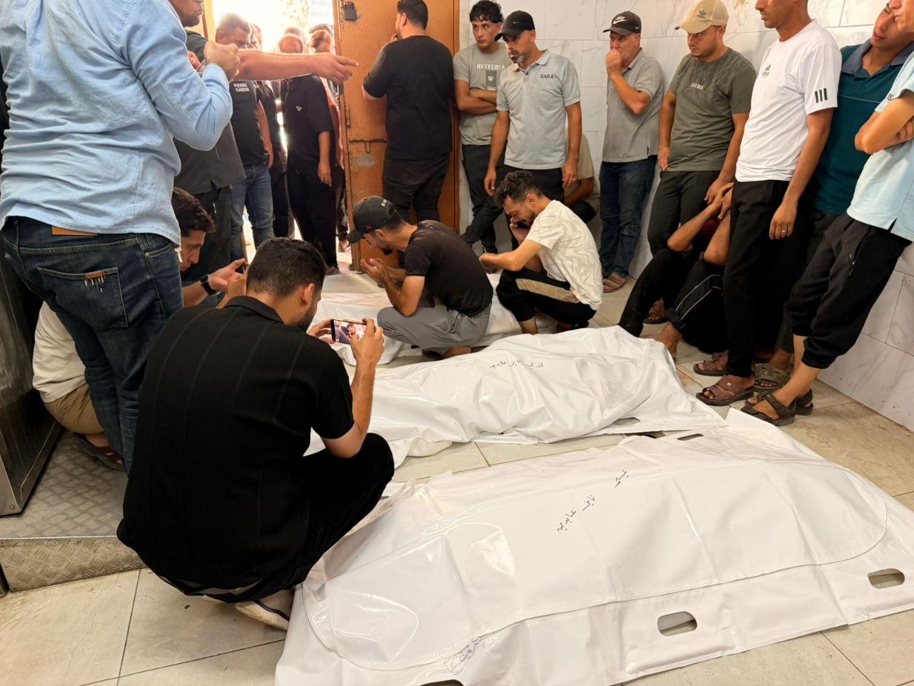 Funeral held in Khan Younis for three Abdeen family members killed in Israeli strike