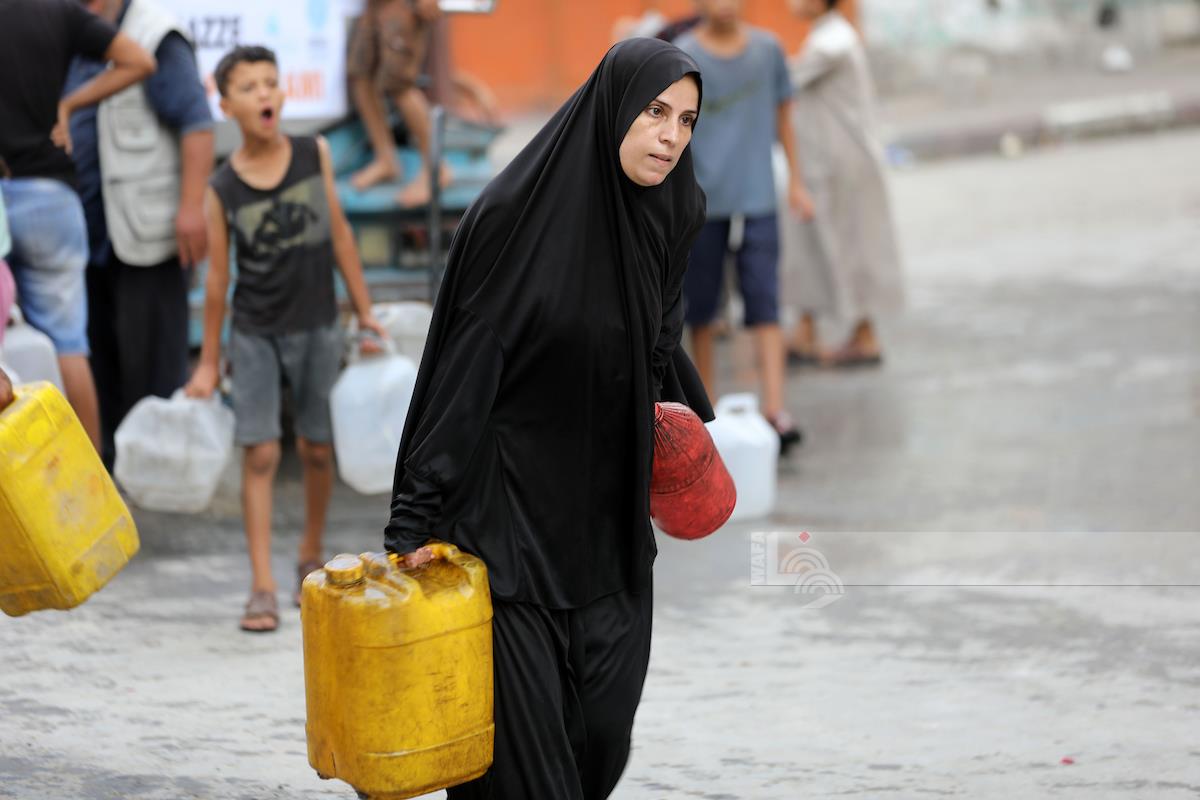 Displaced Palestinians in Gaza City wait to fill water amid severe crisis