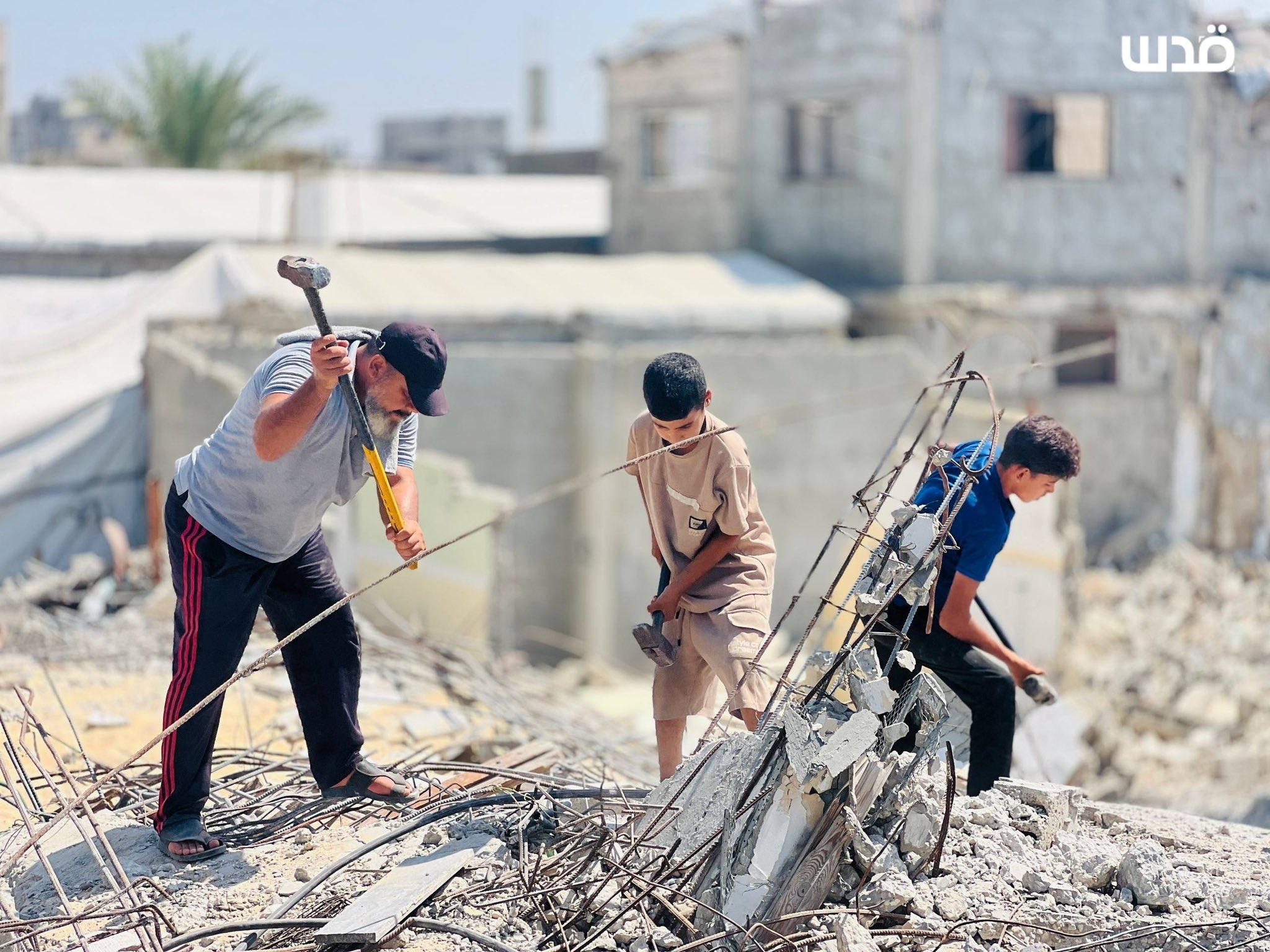 Palestinian family clears rubble of demolished Khan Younis home by hand