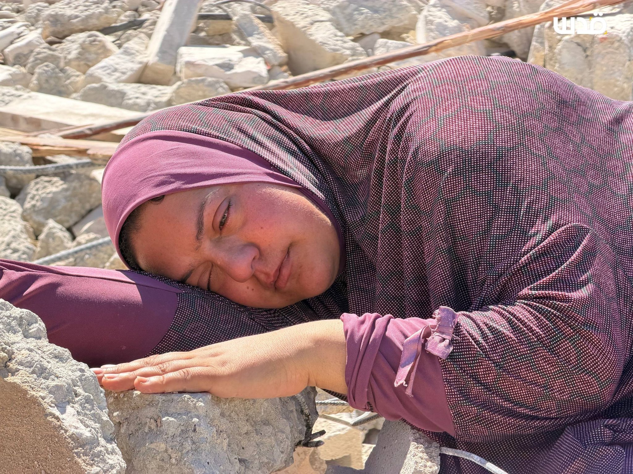 Palestinian woman embraces rubble of demolished home in Beit Awwa