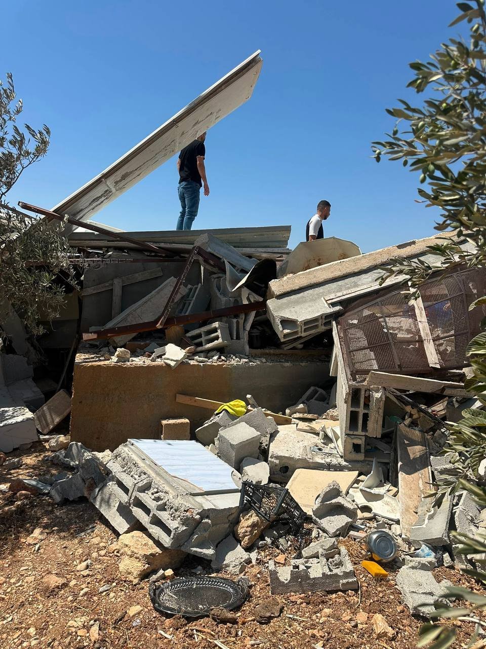 Palestinians inspect demolished agricultural structures in Beit Furik, Nablus