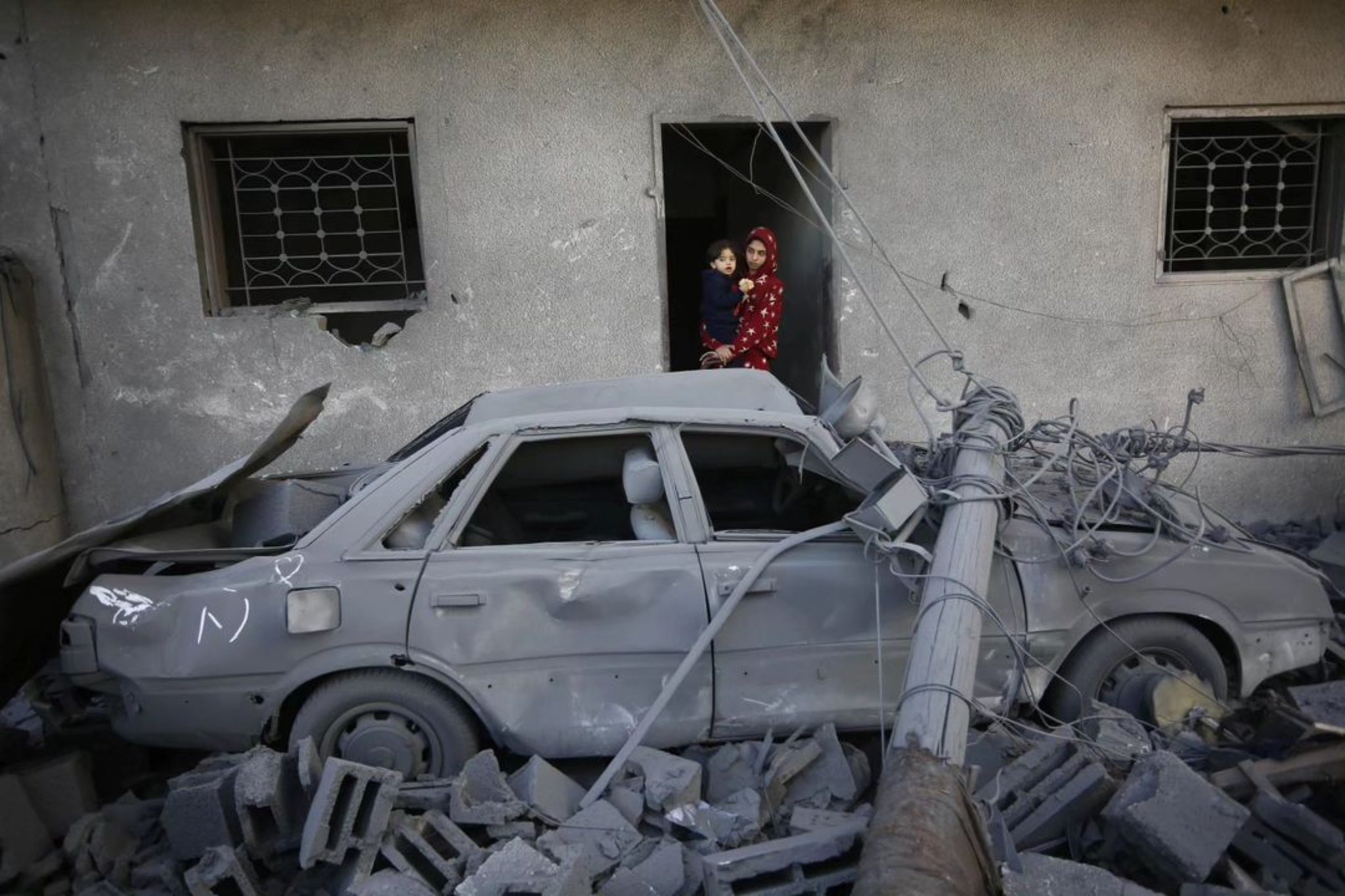 Palestinians search rubble for belongings in Deir al-Balah, Gaza